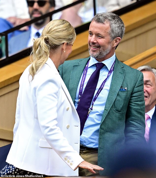 King Frederik of Denmark looked to be in high spirits as he enjoyed the tennis on day eight of Wimbledon this afternoon - without his wife, Queen Mary. Pictured chatting with the Duchess of Edinburgh