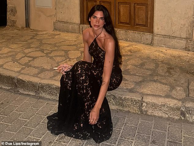 Dua Lipa unabashedly shared a photo of herself holding a cigarette like a fashion accessory