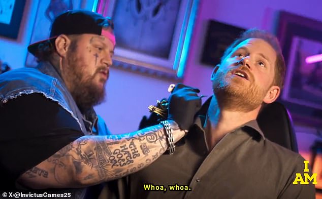 The Duke of Sussex thanked the owner of East Side Ink in New York for his 'skilful dodging' of 'press questions' (pictured with Jelly Roll at the tattoo parlour)