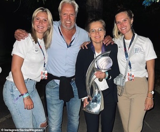Team Sabrina: The England manager pictured with her two daughters, Lauren, far left, and Sacha, far right, and husband Marten Glotzbach in 2022 following the Lionesses' Euros win