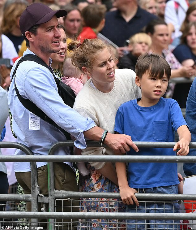 Princess Beatrice (pictured centre) and her husband Edoardo Mozzi (pictured left), joined 65,000 Lionesses fans at their Euros victory parade in London, yesterday. Pictured right, Wolfie, Edoardo's eight-year-old son with his former fiancee, architect Dara Huang