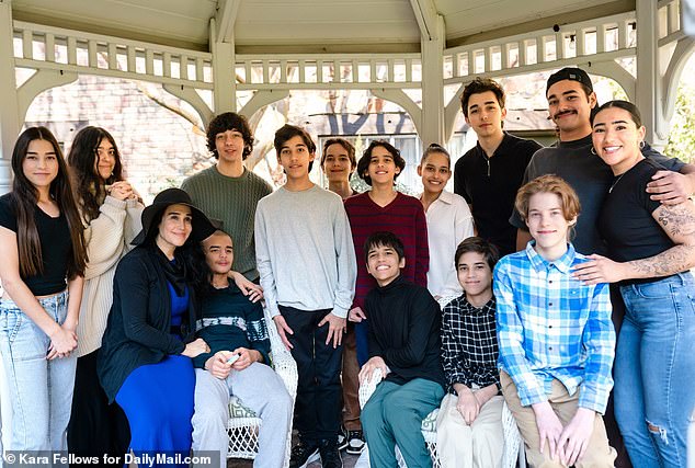 Natalie 'Nadya' Denise Suleman, 50, from Fullerton, California , became famous in 2009 for welcoming eight babies at once using in vitro fertilization (IVF) after her physician implanted 12 embryos in her womb. She is pictured with her whole family above
