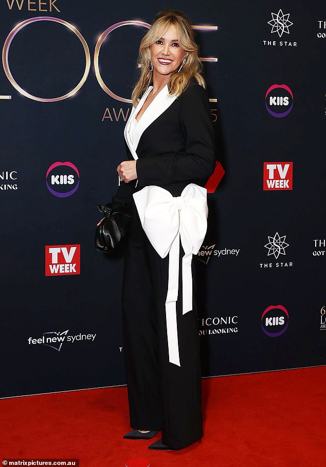 Leila McKinnon's slick, beautifully-tailored power suit delivered class and elegance, while the large bow injected a bit of fun without overwhelming her shape