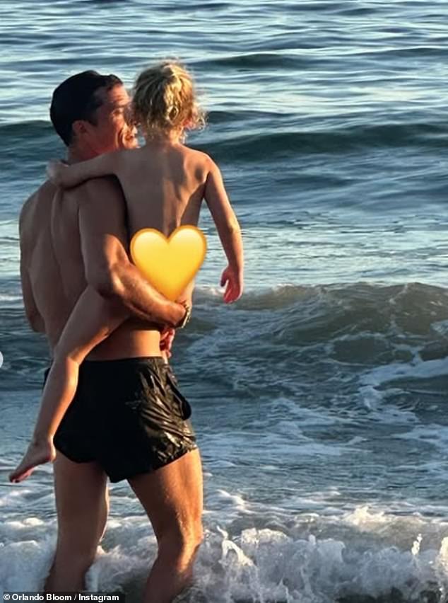 Orlando Bloom is under fire after posting a photo of his naked daughter onto Instagram before editing it to have an emoji covering her