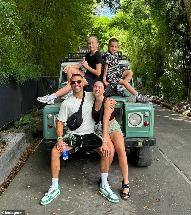 Matt Cameron, 46, has traded the sky-high rents, crippling taxes and government 'overreach' for a luxury Balinese villa with staff on call around the clock. Pictured: Matt (front left) with his partner Felicity, 34, and her two children
