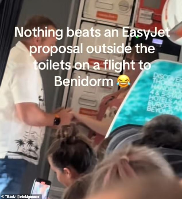 A man has caused a storm online after proposing to his girlfriend during an EasyJet flight to Spain