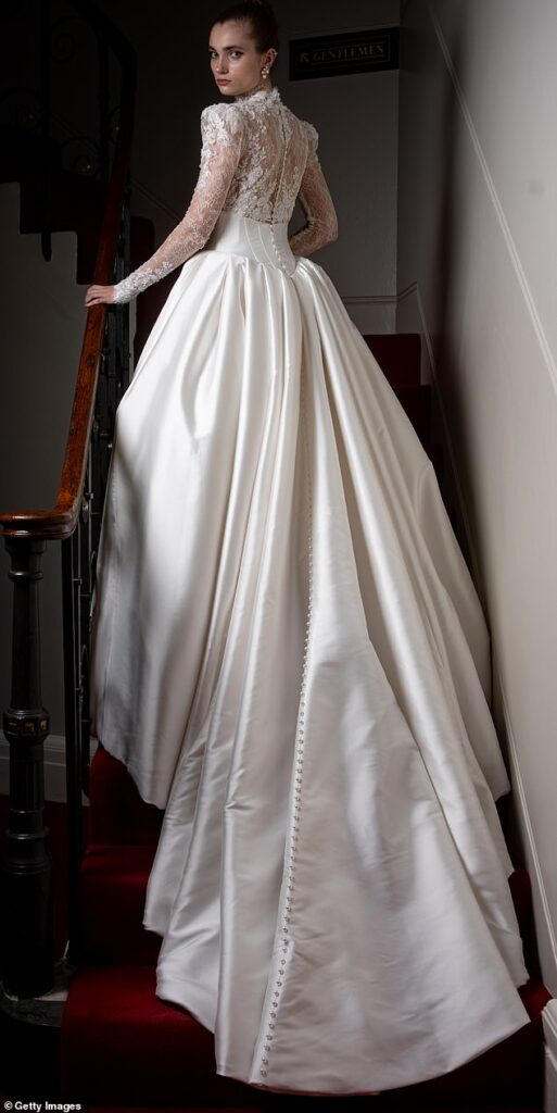 A debutante poses in her bridal gown during 2025's Queen Charlotte's Anniversary Ball on Saturday