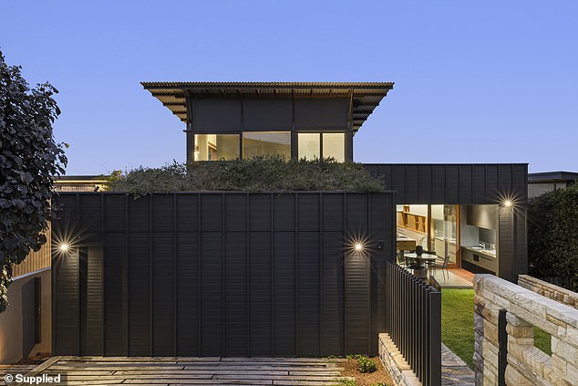 Perched high on one of the Northern Beaches' most coveted headlands, a mysterious black home in Mona Vale has locals stopping in their tracks