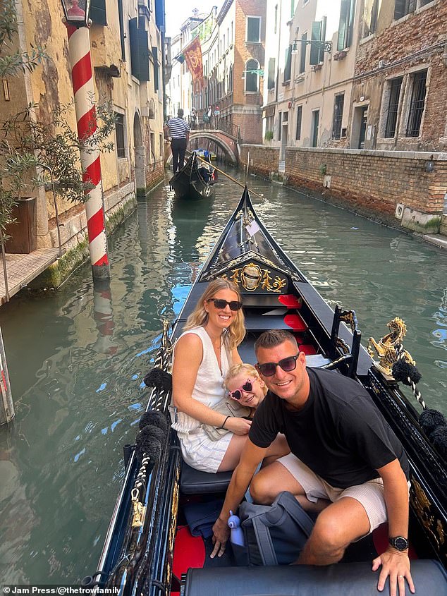 A couple currently taking a 'gap year' to travel the world with their six-year-old daughter have revealed the multi-city holiday is cheaper than living in the UK. Pictured: Hayley and Lewis Trow at their former home in Cheshire