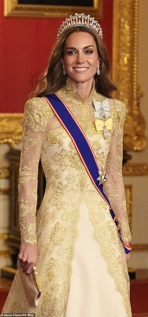 Kate wore her chocolate brow tresses down in a wavy blow-dry, with Princess Diana 's Lovers' Knot tiara placed gently on top of her head for the glitzy occasion