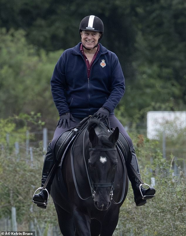 Prince Andrew (pictured) appeared to be grinning when he was photographed while horse riding in Windsor Great Park on Saturday