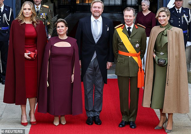 Ahead of the abdication ceremony on Friday, Luxembourg's Grand Duke Henri and Grand Duchess Maria Teresa pose for a picture with Dutch King Willem-Alexander, his wife Queen Maxima and their daughter, Princess Catharina-Amalia