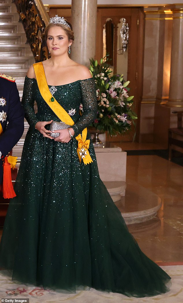 Putting her best fashion foot forward, Princess Catharina-Amalia donned a stunning £7,600 jade off-the-shoulder ballgown embroidered with glittering diamantes on Friday evening