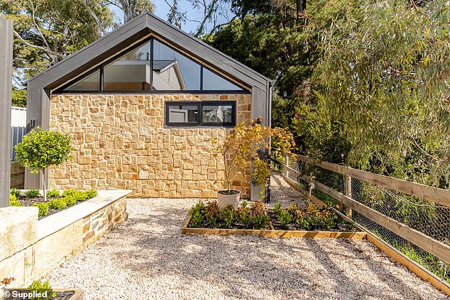 An unassuming stone cottage tucked away in the Adelaide Hills has quietly captured the nation's attention - and not just for the glorious interiors behind its timber door