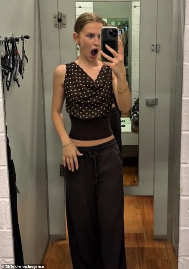A $20 brown polka-dot top from Kmart is quickly becoming this season's most talked-about wardrobe essential. Pictured: Content creator Hannah Rogers wearing the garment in her recent Kmart clothing haul